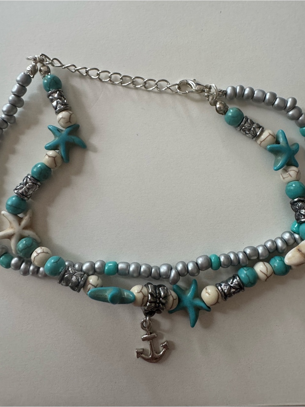 Gustavo double layered ankle bracelet ft star fish, Sea turtle & Anchor charm